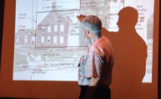 [photo: Joel Orosz giving a presentation on the first U.S. Mint in Philadelpia]