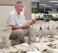 Littleton Coin's president David Sundman among bags of Ikes from the Big Sky Hoard