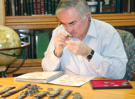 David examining a group of coins from this remarkable accumulation