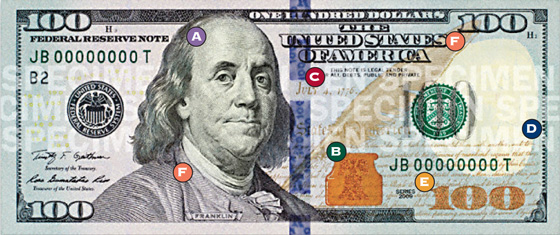 [photo: Security features on a Series 2009 $100 Federal Reserve Note]
